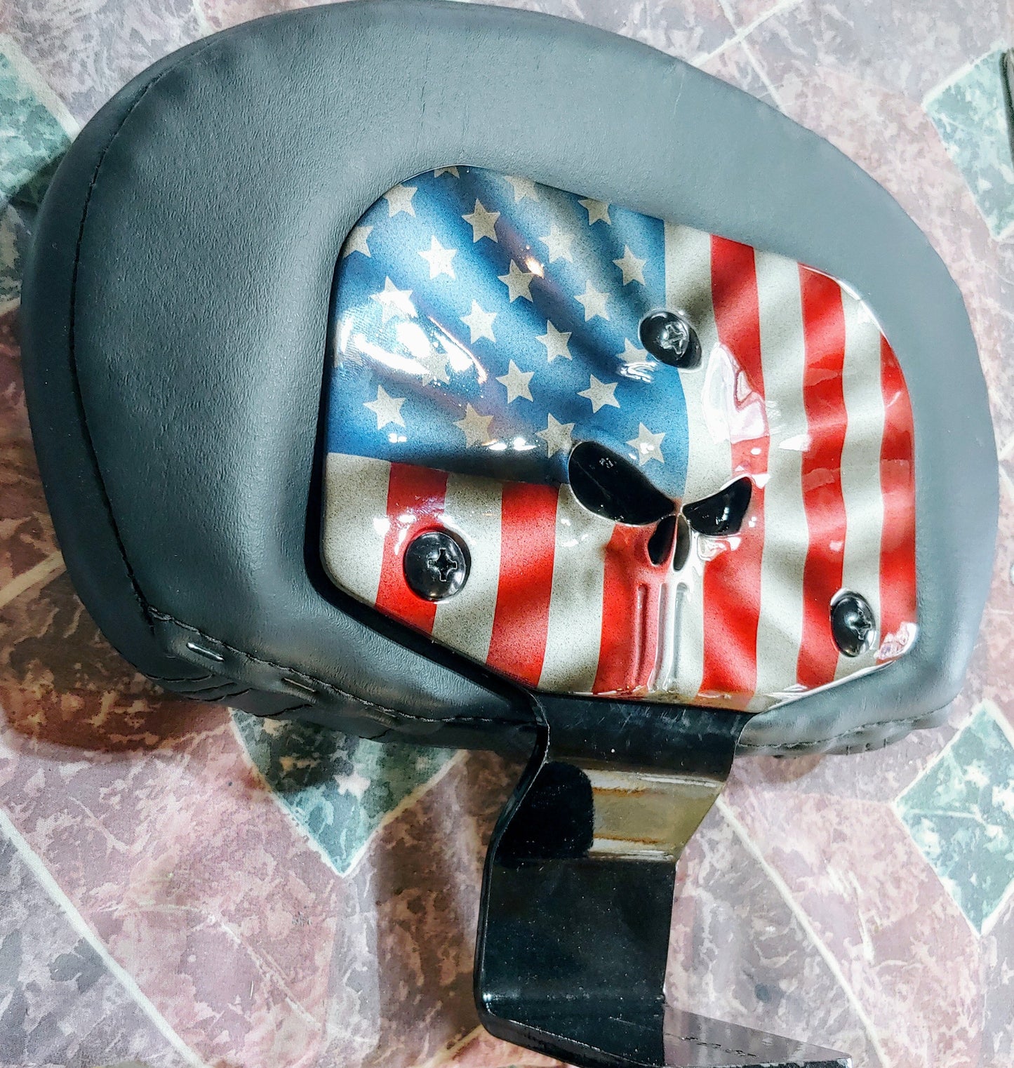 Custom Harley backrest plate with punisher stretching through
