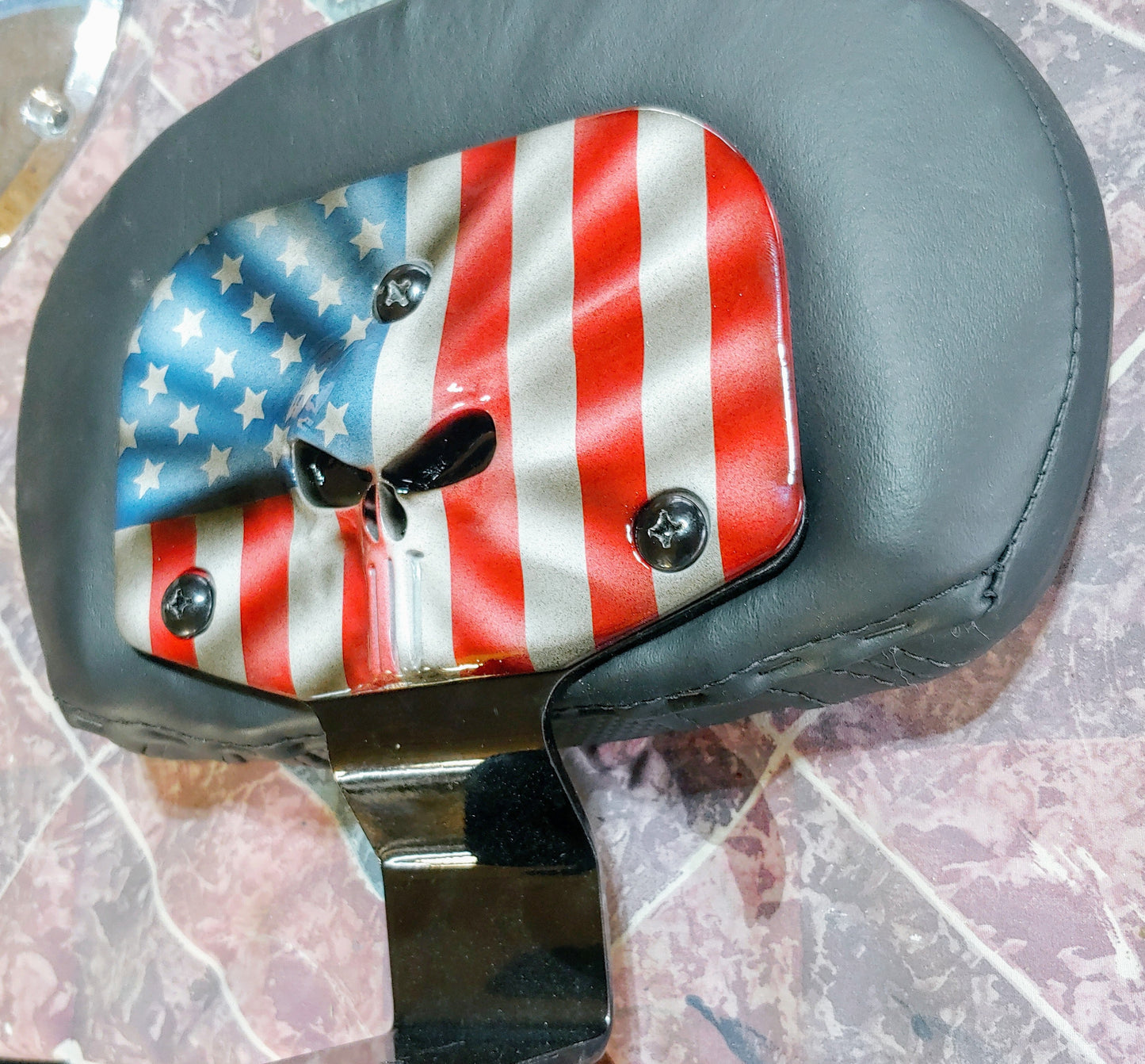 Custom Harley backrest plate with punisher stretching through