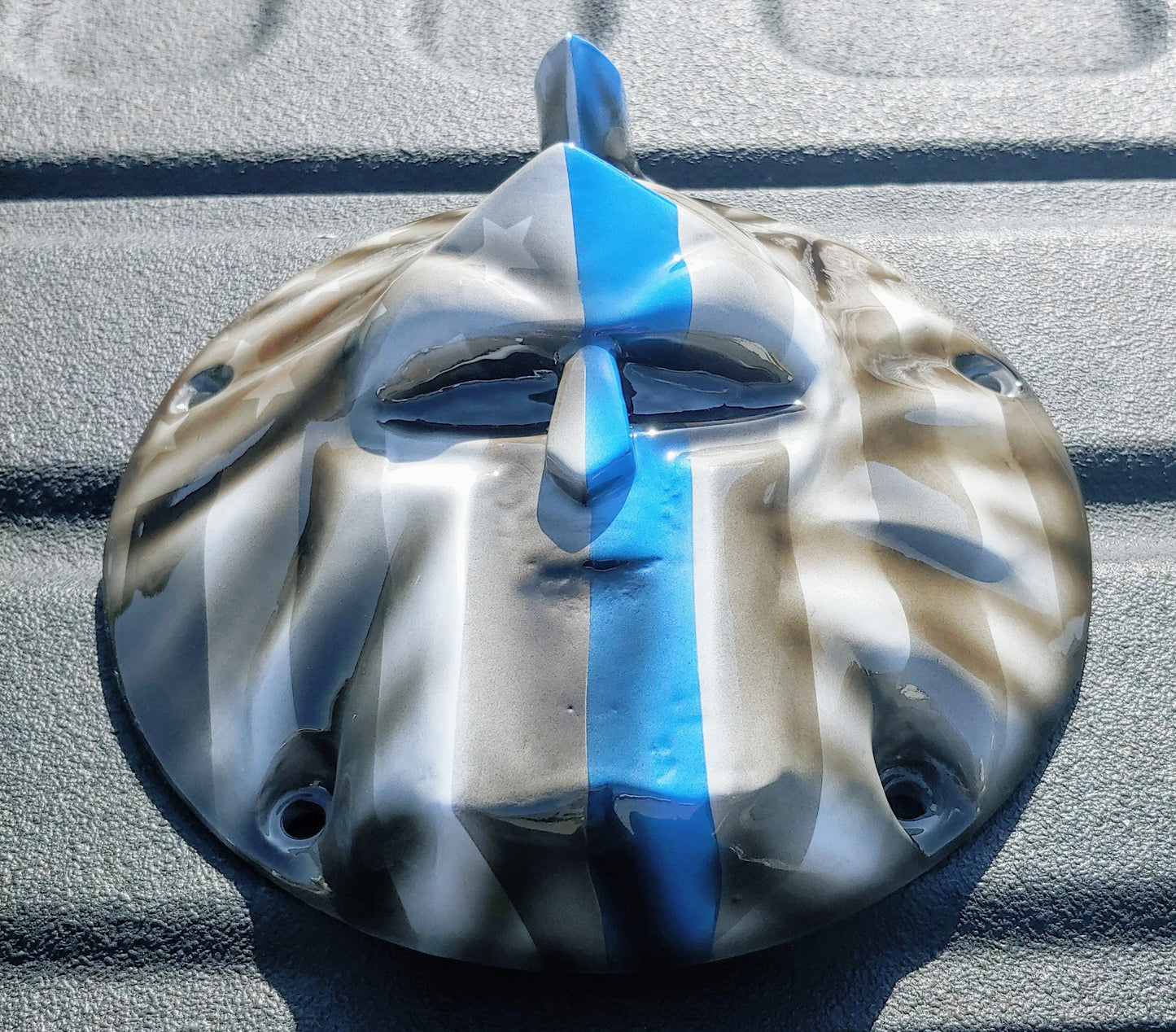 Spartan stretching through Thin Blue Line Flag Harley derby cover