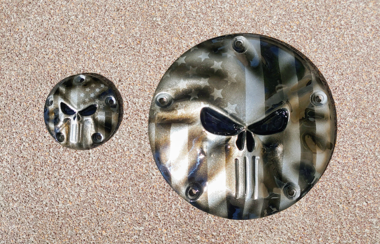 Punisher stretching through black and silver Flag Harley derby and points cover