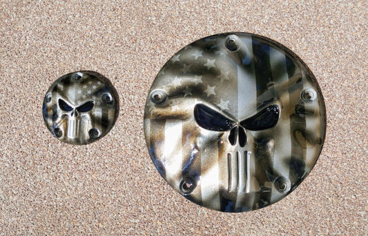 Punisher stretching through black and silver Flag Harley derby and points cover