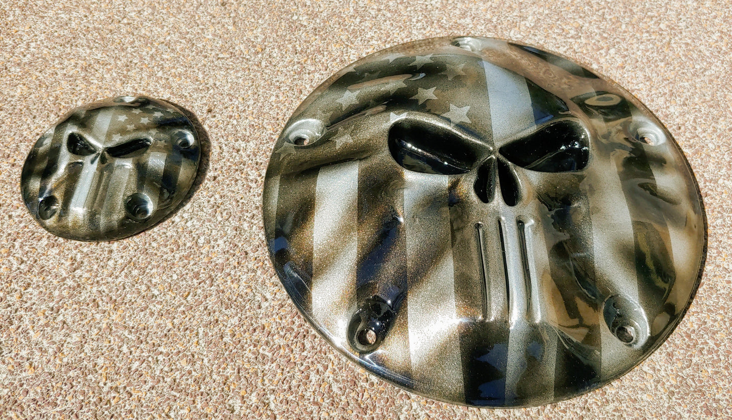 Punisher stretching through black and silver Flag Harley derby and points cover