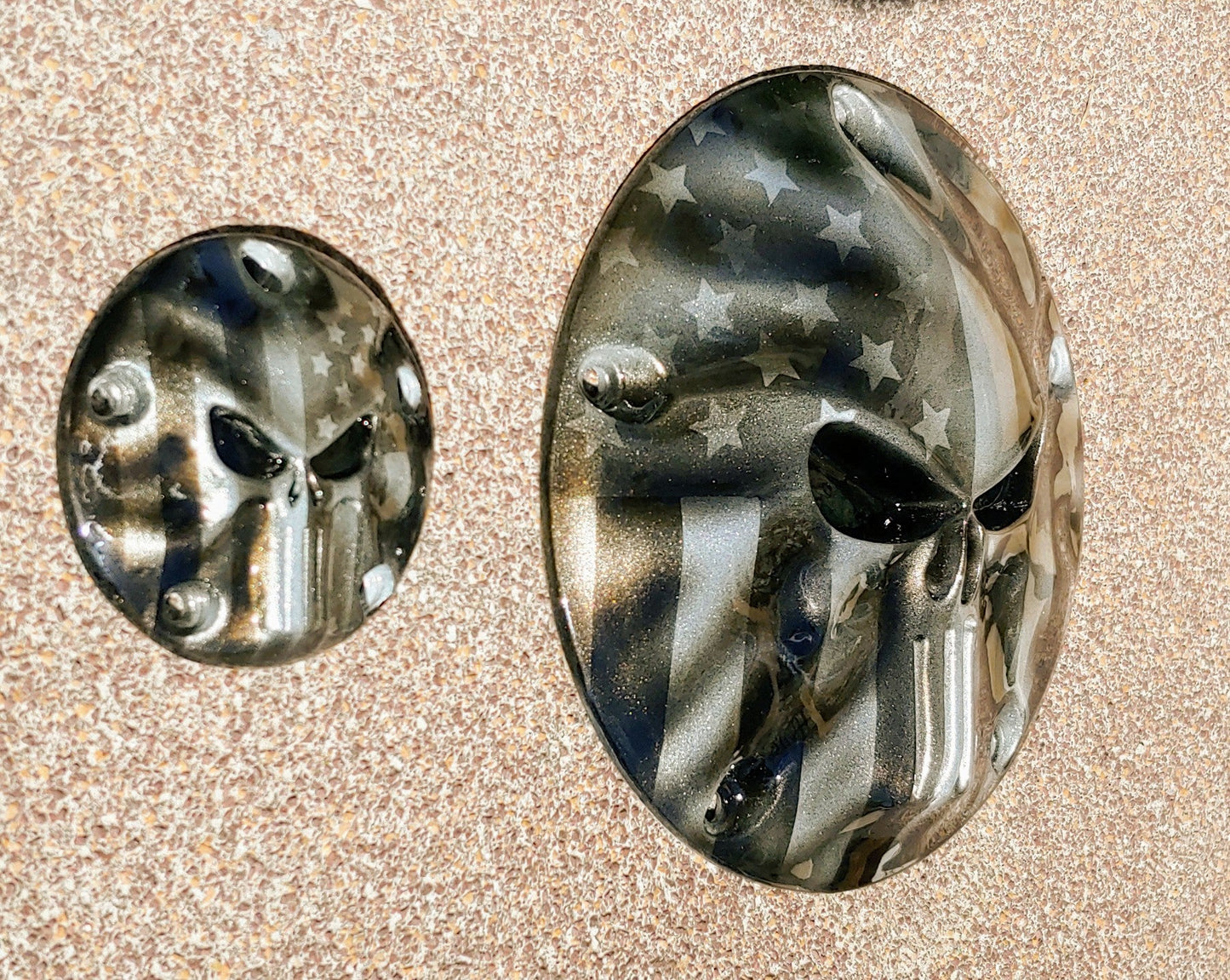 Punisher stretching through black and silver Flag Harley derby and points cover