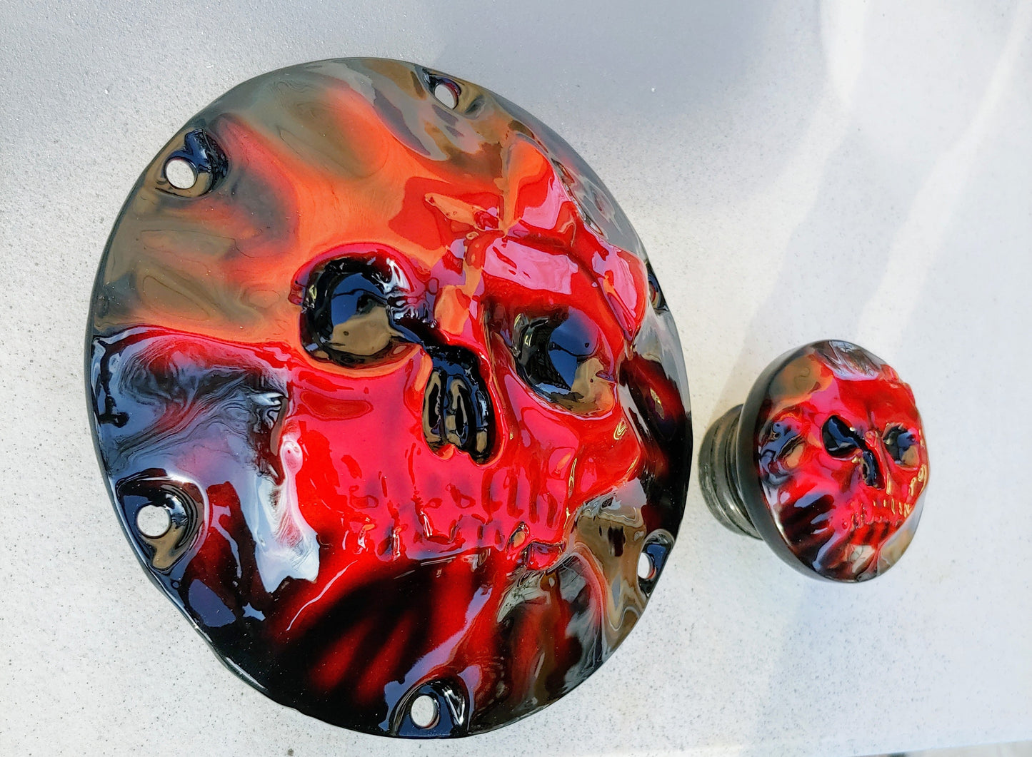 Skull and bow pushing through on Harley Davidson derby cover and fuel cap