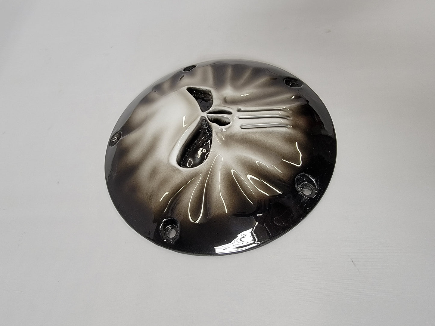 Punisher stretching through Harley derby cover