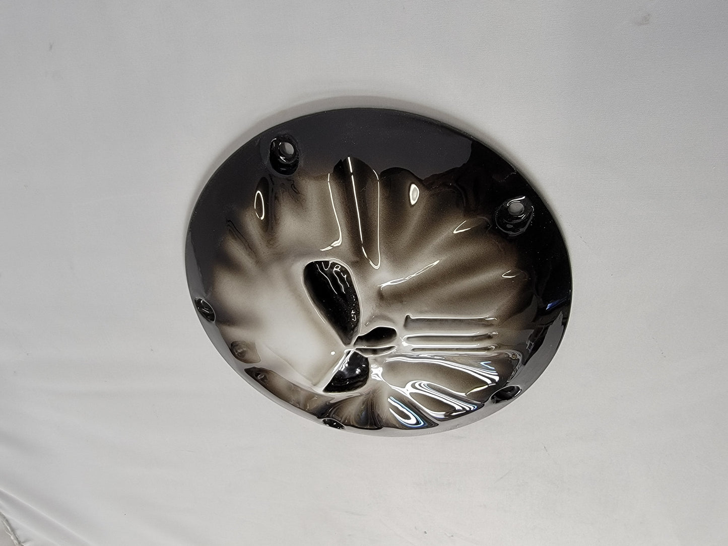 Punisher stretching through Harley derby cover