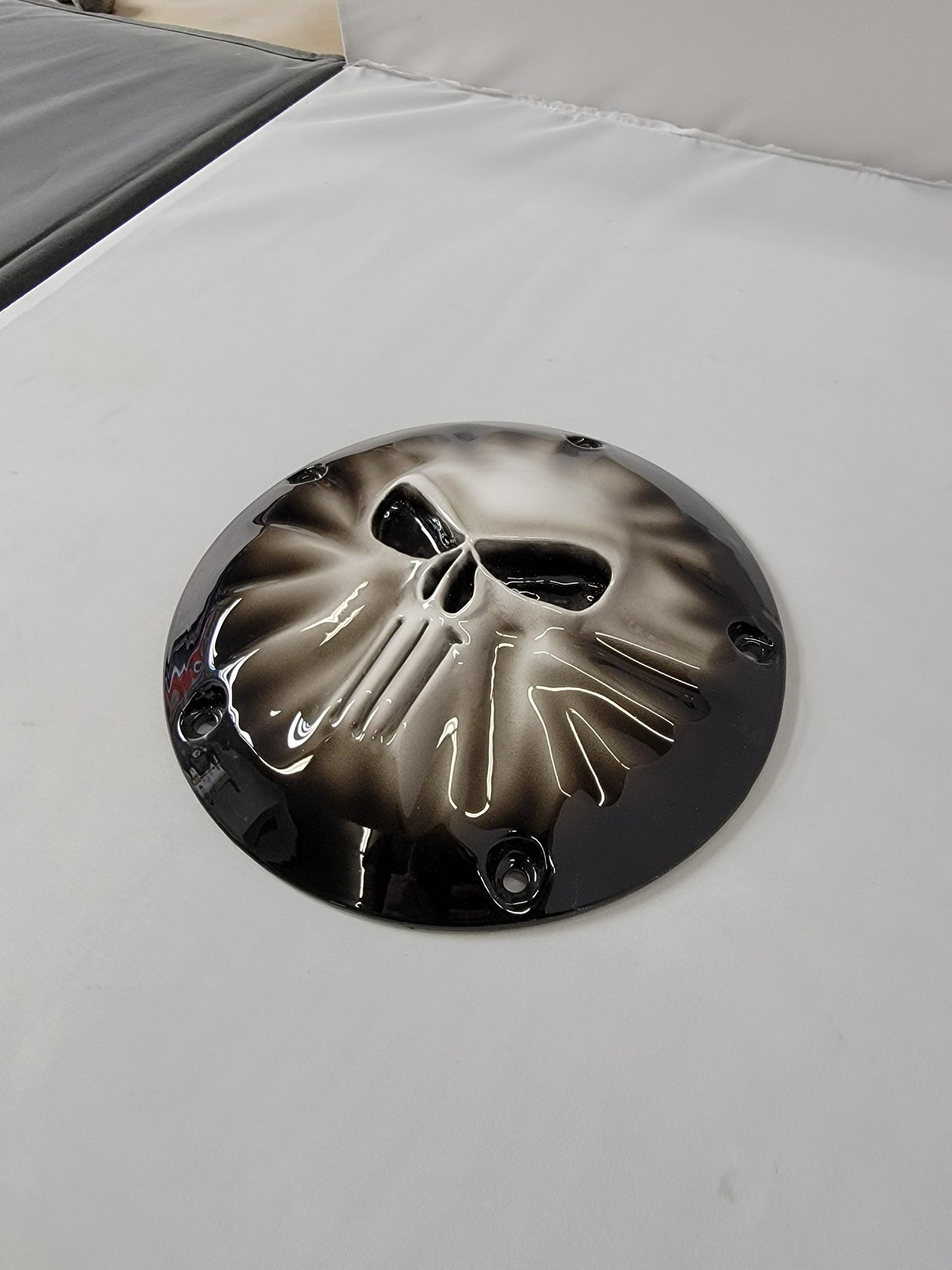 Punisher stretching through Harley derby cover