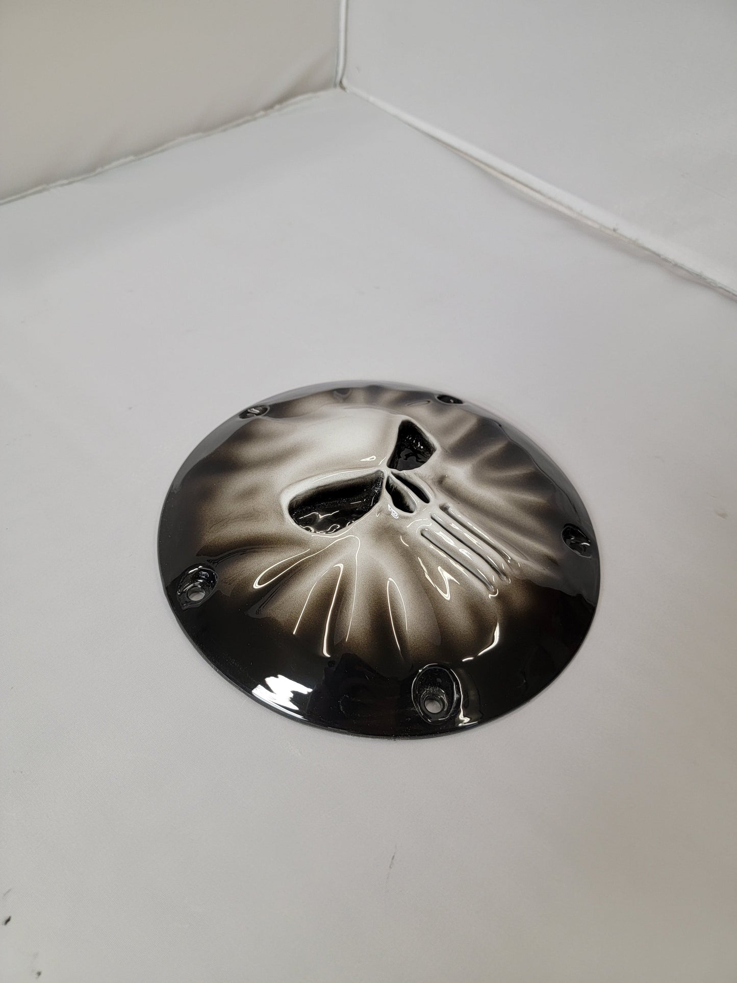 Punisher stretching through Harley derby cover