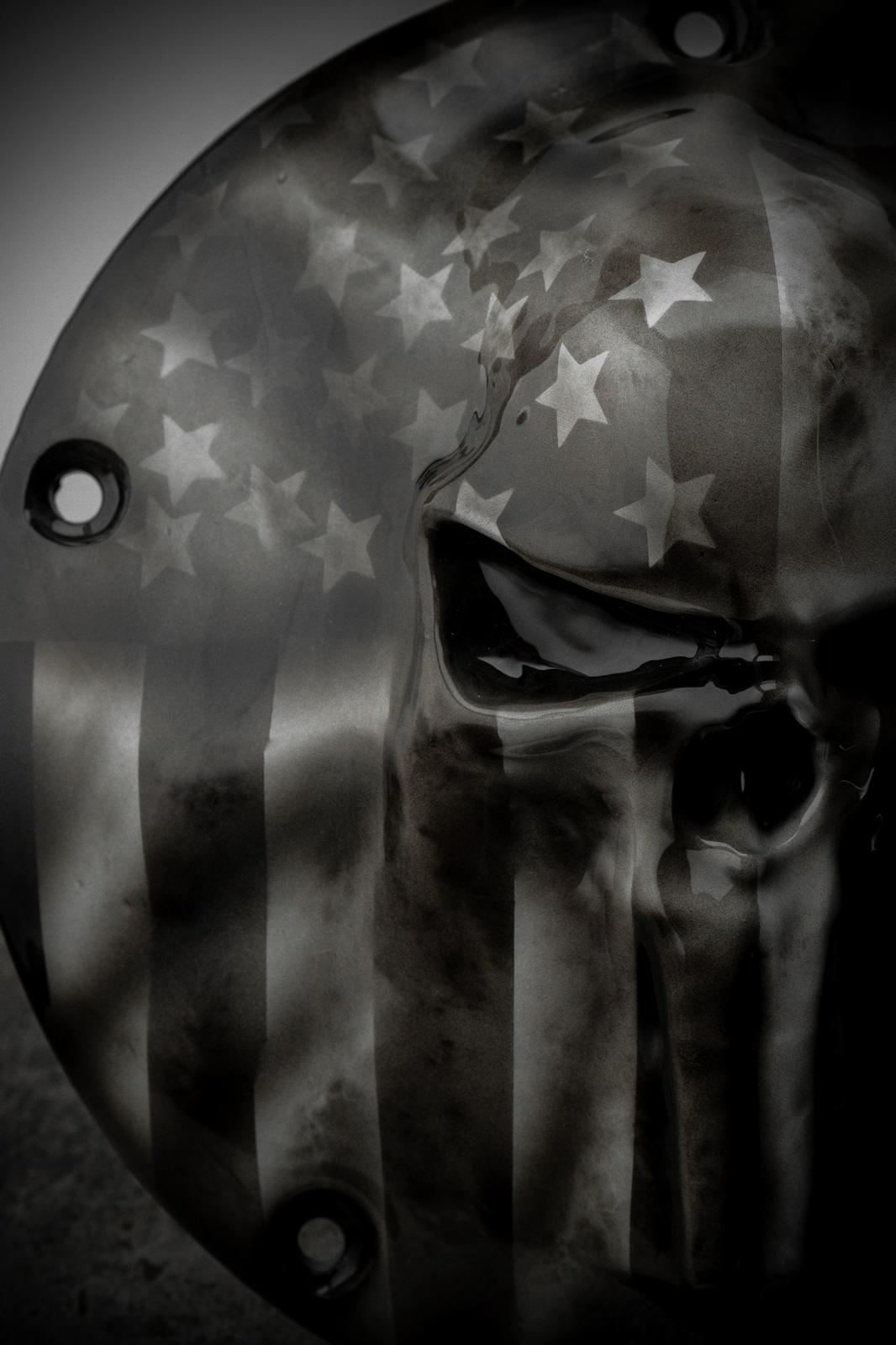 Punisher skull stretching through flag Harley derby cover