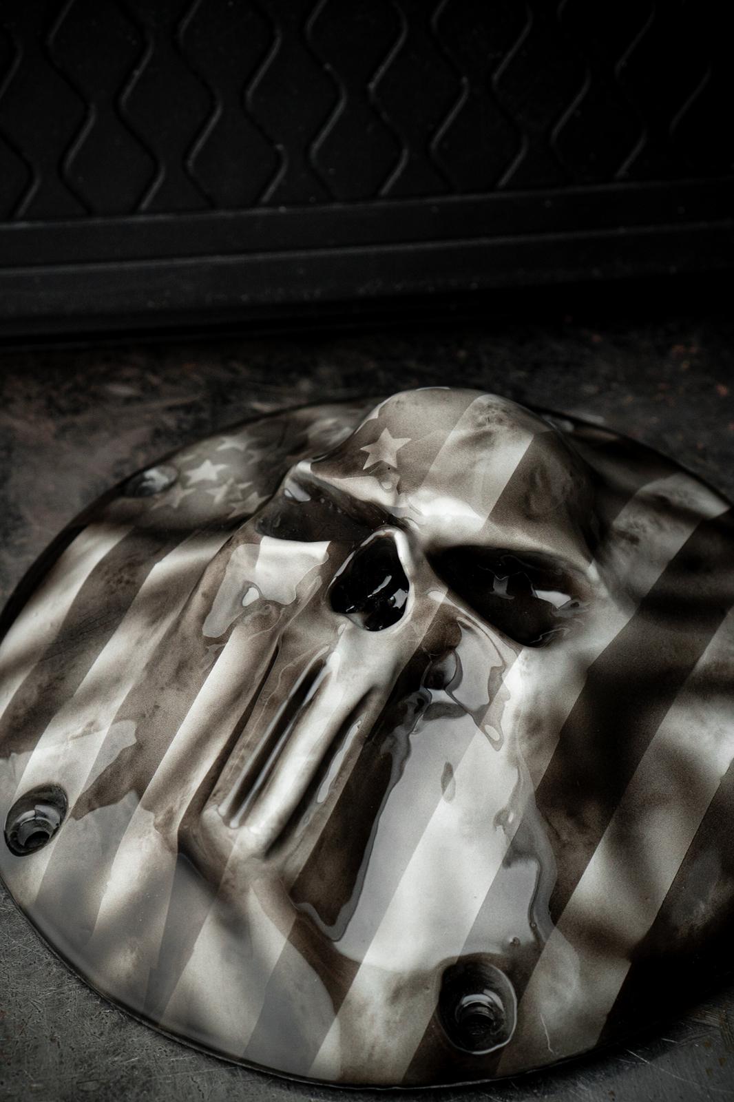 Punisher skull stretching through flag Harley derby cover