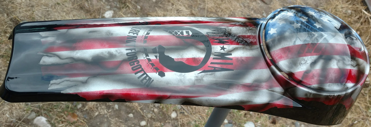 Harley Davidson POW-MIA tribute on a worn and tattered American flag console
