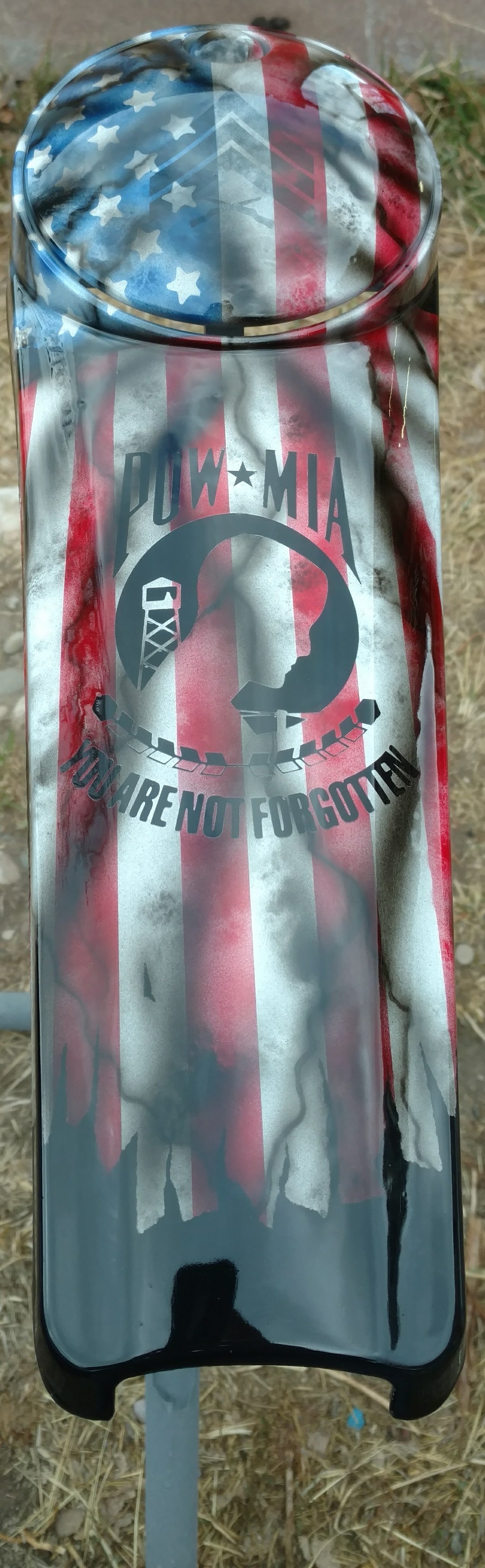 Harley Davidson POW-MIA tribute on a worn and tattered American flag console