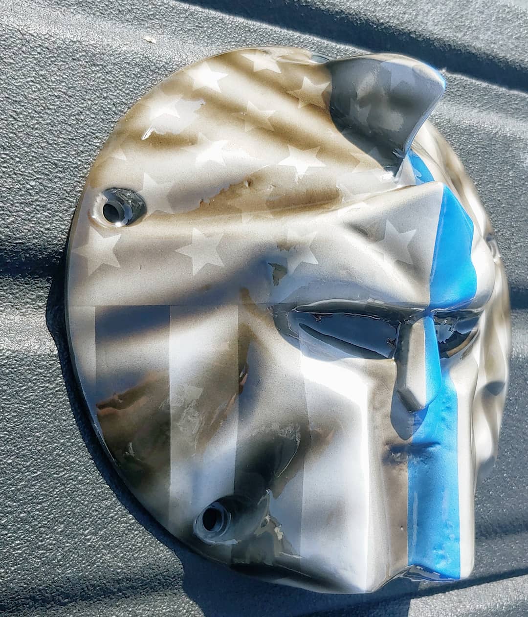 Spartan stretching through Thin Blue Line Flag Harley derby cover