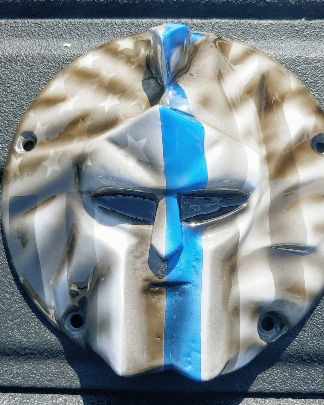 Spartan stretching through Thin Blue Line Flag Harley derby cover