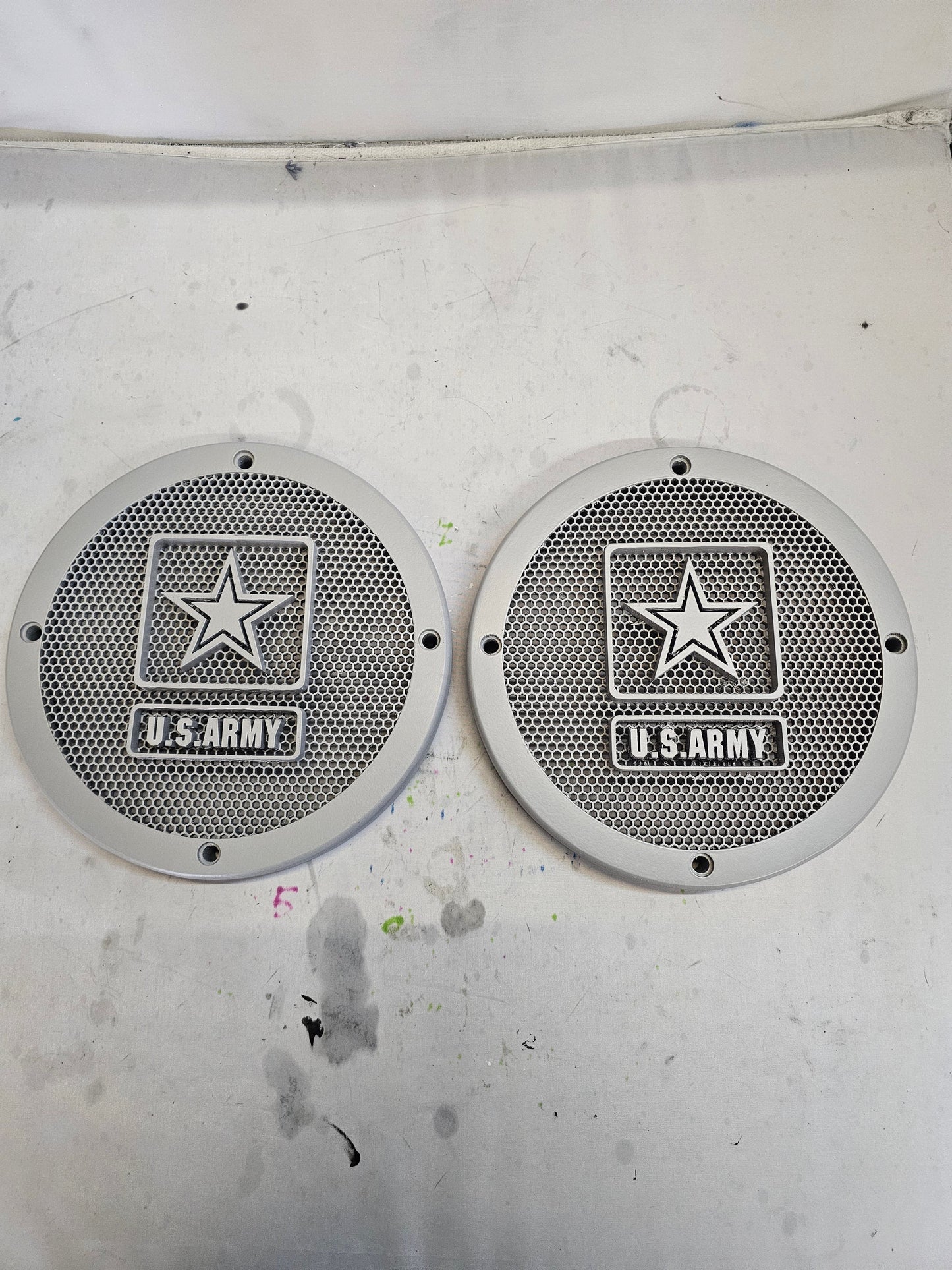 A set of Army speakers grill covers